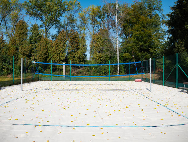 istock Empty volley ball court within fall season. Dry leaves 1283741761