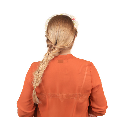 Pretty girl with thick long braid. Isolated over white background. Close-up.