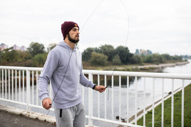 istock Young man working out in bad weather 1283742814