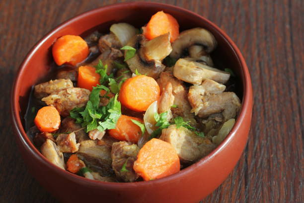istock Meat stew with vegetable on rustic wooden background 1283744067