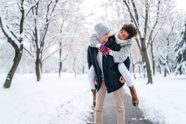 istock Piggyback ride in the snow 1283745482