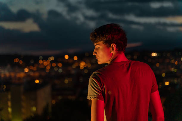 istock Young man with city views at night 1283745991