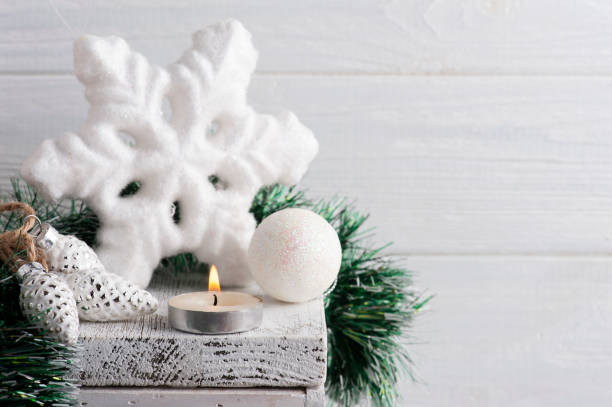 istock Christmas white star and lit candle 1283746054