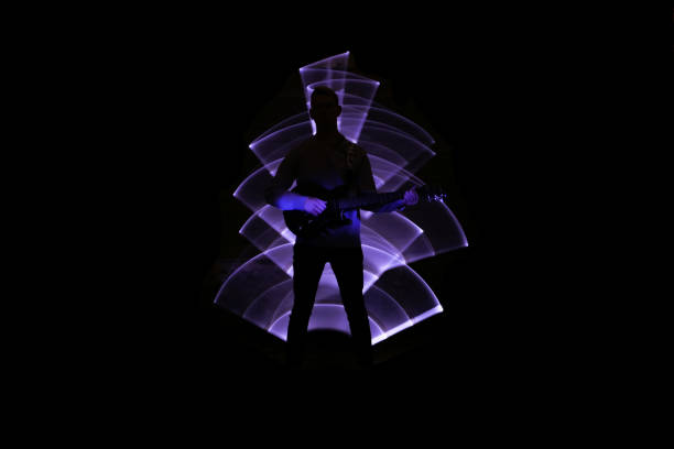 istock Silhouette of a man with a guitar. 1283746967