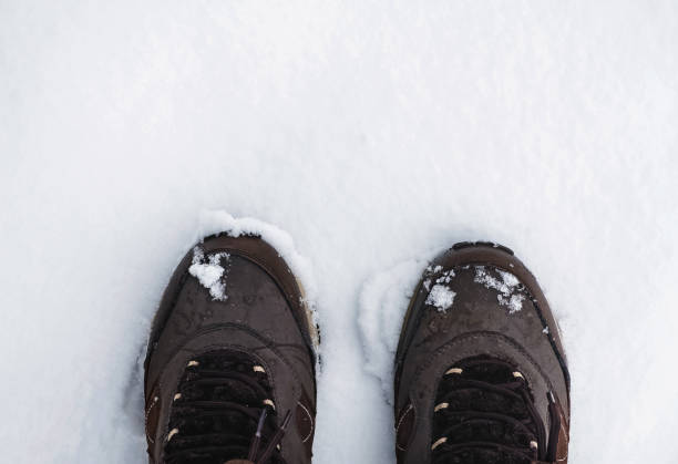 istock Snow shoes on a white snow during winter walk 1283747120