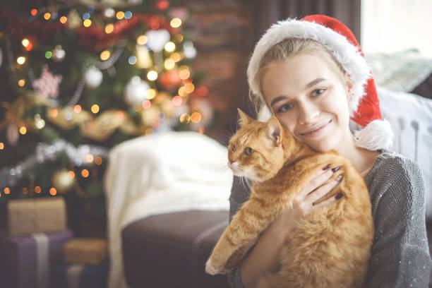 istock young woman in christmas interior 1283748529