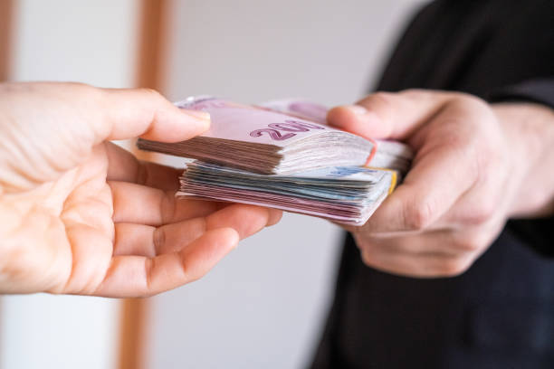 istock Giving Cash Money 1283754538
