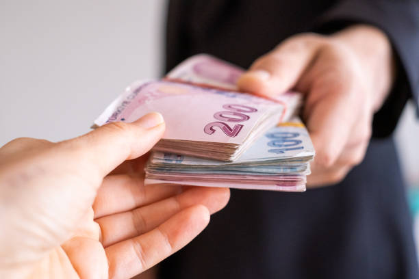 Giving Cash Money Paying with cash money stack turkish lira photos stock pictures, royalty-free photos & images