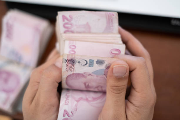 istock Close up to man's hand Counting Turkish Money 1283755177