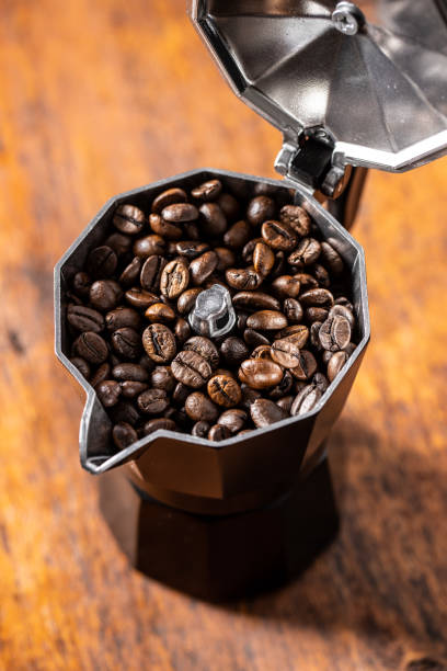 istock Roasted coffee beans in mocca pot 1283756298