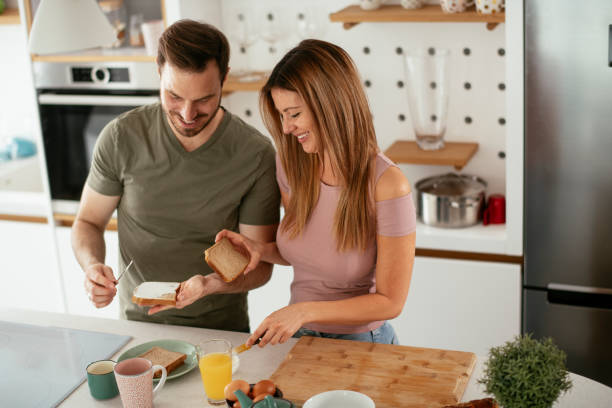 istock Young couple making sandwich at home. 1283759917