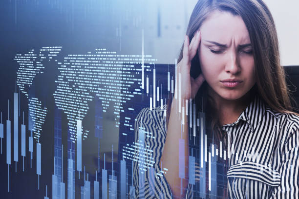 istock Stressed businesswoman in office, map and graphs 1283764064