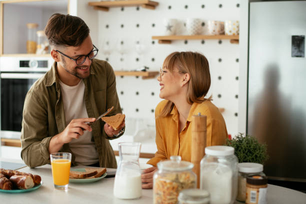 istock Young couple making sandwich at home. 1283764824