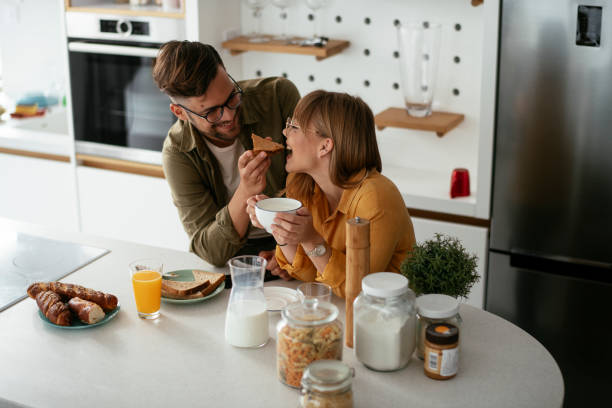 istock Young couple making sandwich at home. 1283764938