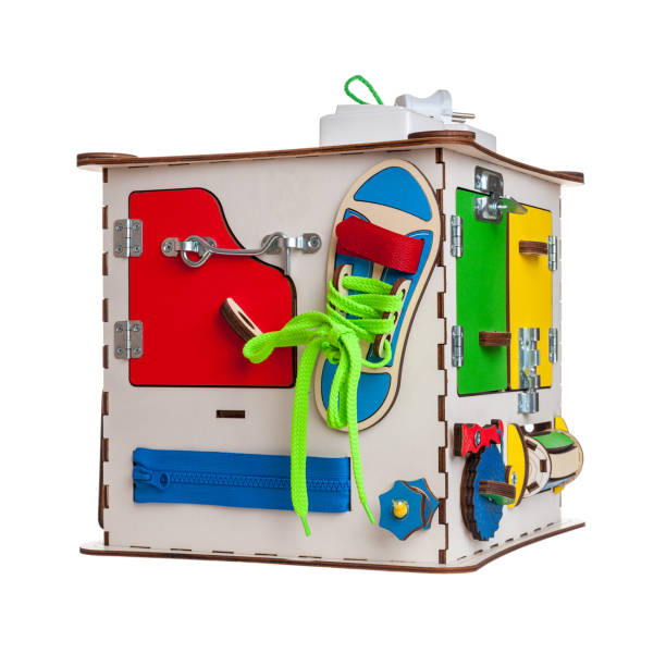 istock children's educational toy busycube, busyboard, isolated on a white background, the development of motor skills and coordination in kids, design 1283765124