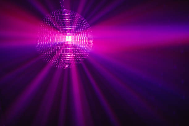 istock disco ball background with purple shiny rays 1283768164