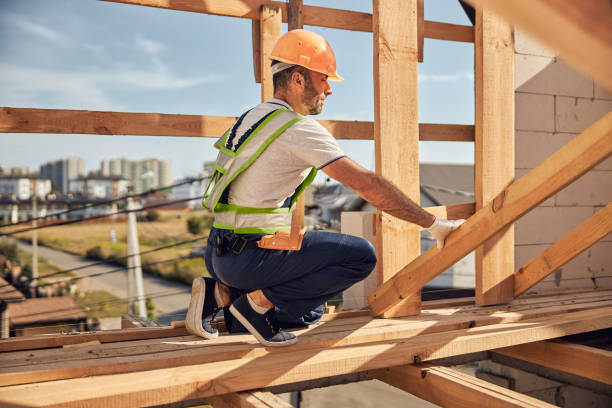 istock Serious constructor standing on the top floor of building 1283768439