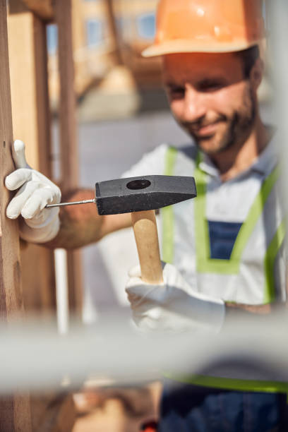 istock Focused photo on hammer being in male hand 1283768459