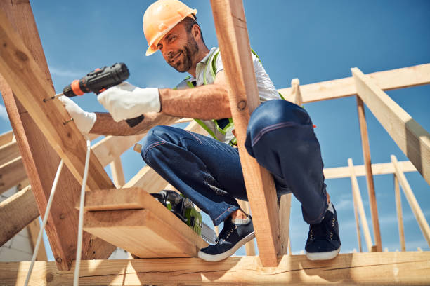 istock Cheerful bearded man fastening self-tapping screws into beam 1283768505