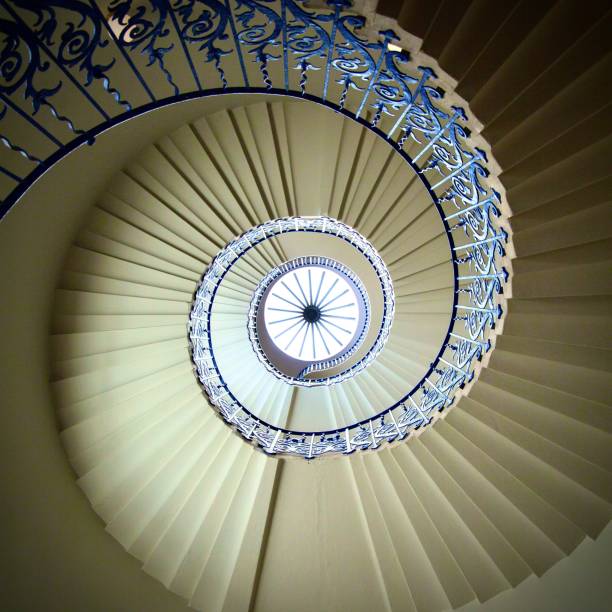 istock Spiral staircase with blue handrail 1283769438