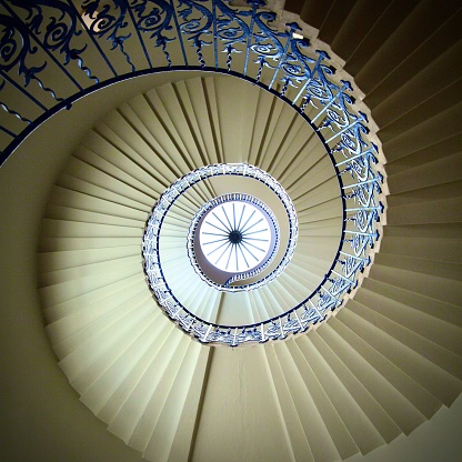 Spiral staircase with blue handrail
