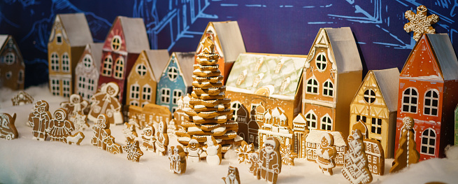 Gingerbread houses stand in a row .The concept of the winter holidays