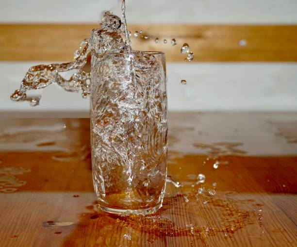 Pouring crystal clear water into a glass
