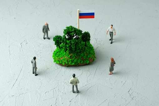 Businessman/Politician figurines examine Russia
