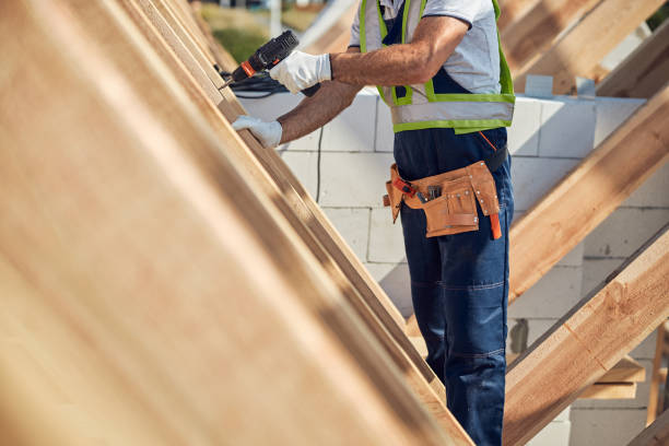 istock Male builder drilling in the wooden frame 1283773512