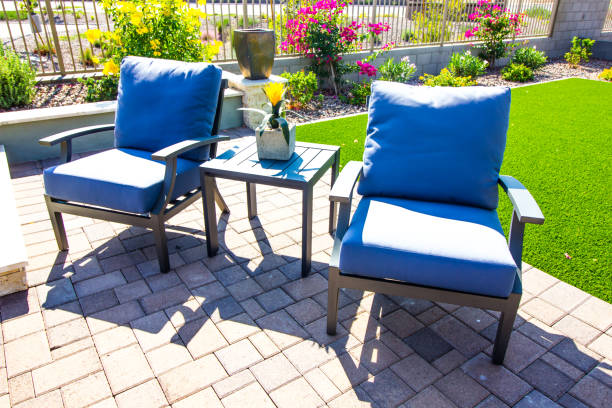istock Rear Patio With Two Arm Chairs With Cushions & Table With Centerpiece 1283774429