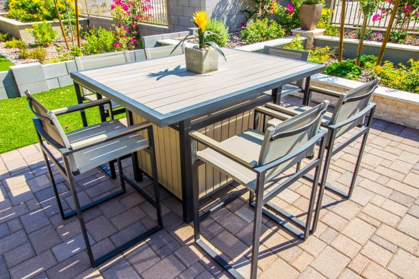 istock Rear Yard Patio Table & Chair Grouping With Centerpiece 1283774533