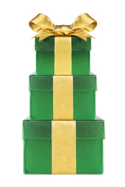 istock Stacked green gift boxes wrapped with gold bow and ribbon isolated on white 1283775356