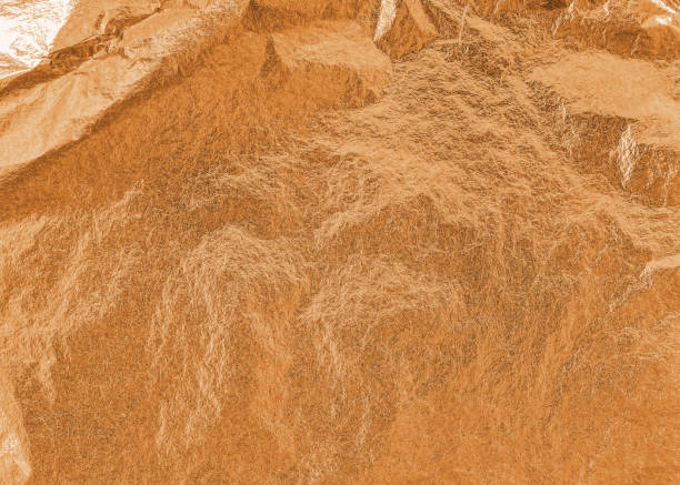 istock Copper gold texture metallic wrapping foil leaf paper shiny orange background for wall paper decoration element 1283776318