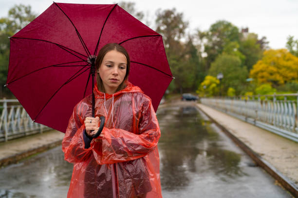 istock Woman standing on the rain 1283777122