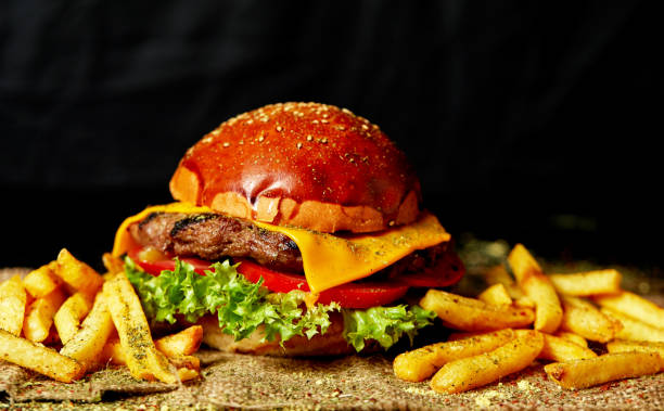 istock Delicious fresh homemade burger on a wooden table 1283777883