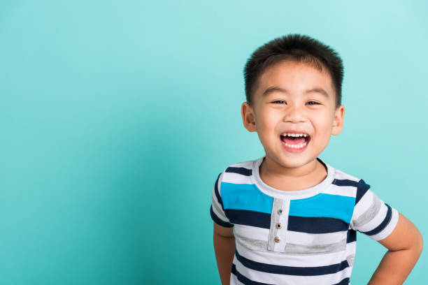 Asian portrait of cute little boy kid happy face he laughing smiles stock photo