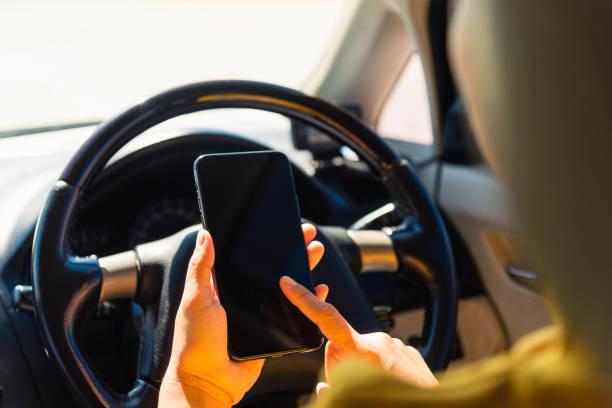 istock woman inside a car and using touch screen on mobile smartphone 1283795895
