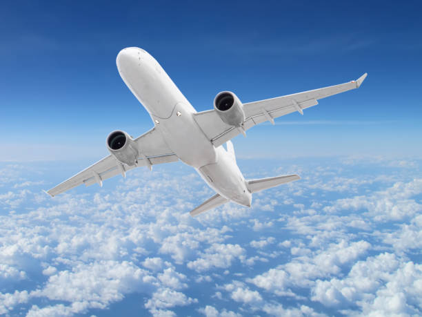 istock large white passenger plane flies high above the clouds 1283796635