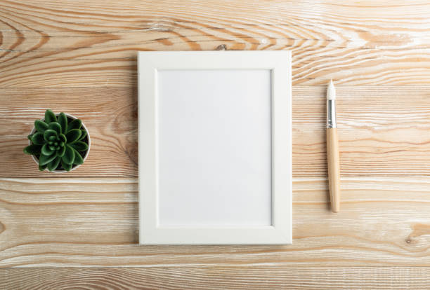 istock Minimal artist mockup with brushes on wood table flat lay 1283796755