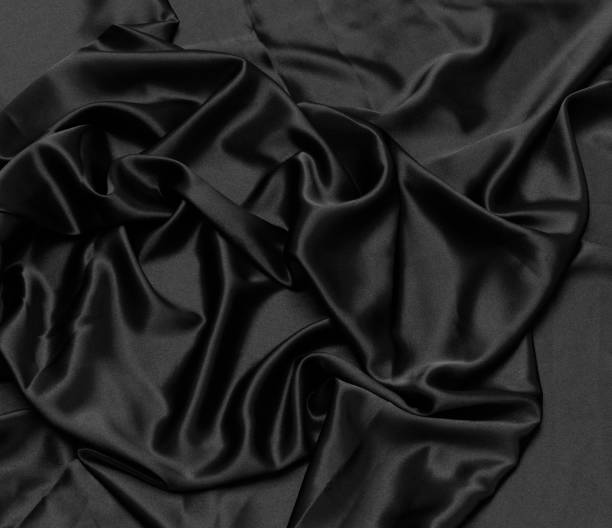 istock black silk fabric background silky textured cloth 1283799489