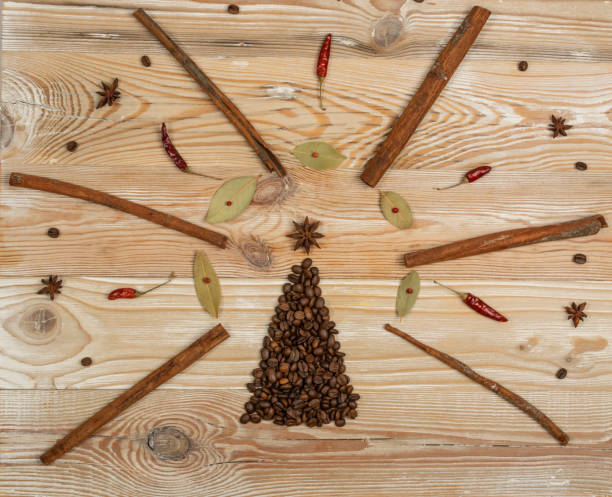 istock Christmas Tree Shape Made of Coffee Beans on Wooden Table 1283800353