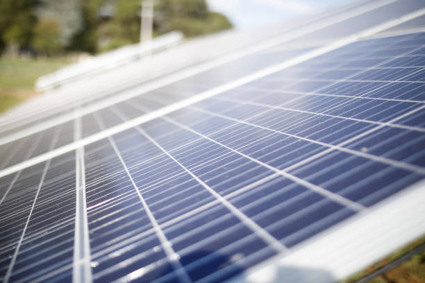 istock Solar panels close up on a solar farm 1283803895