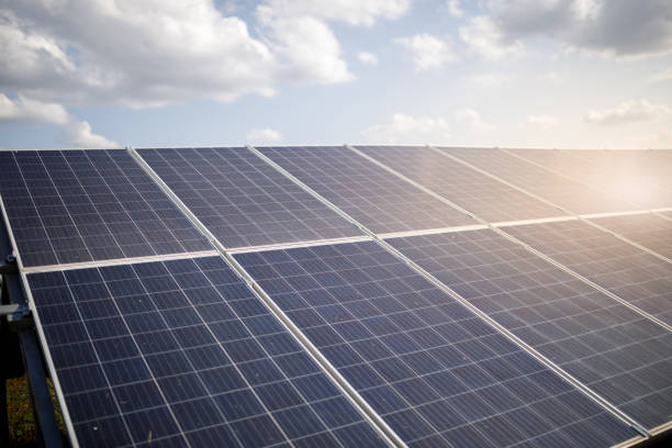 istock Solar panels close up on a solar farm 1283803900