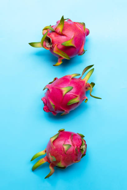 istock Dragon fruit or pitaya on blue background. Delicious tropical exotic fruit. Top view 1283804608