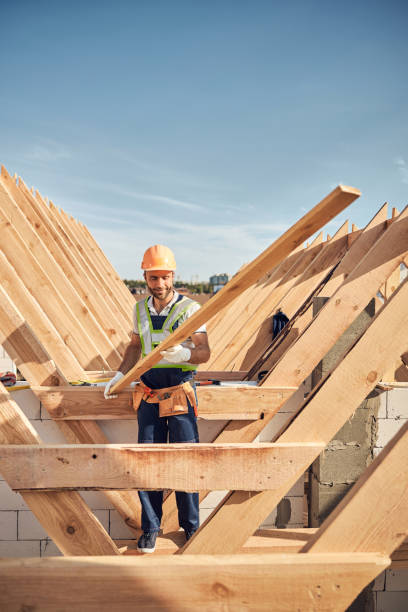 istock Gladsome man using wood for the roof construction 1283804835
