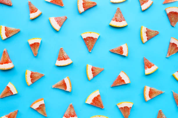 High vitamin C. Juicy grapefruit slices on white.