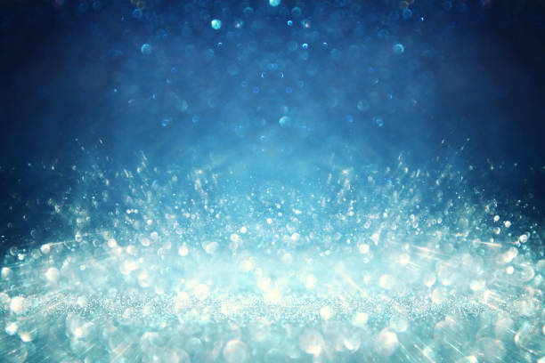 istock background of abstract glitter lights. silver, blue and black. de focused 1283805669