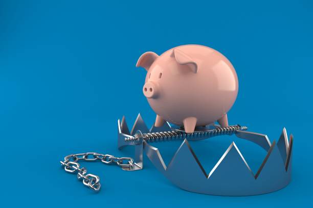 istock Piggy bank on bear trap 1283806209