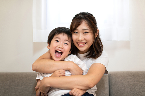 Portrait of Asian mother and child in the room