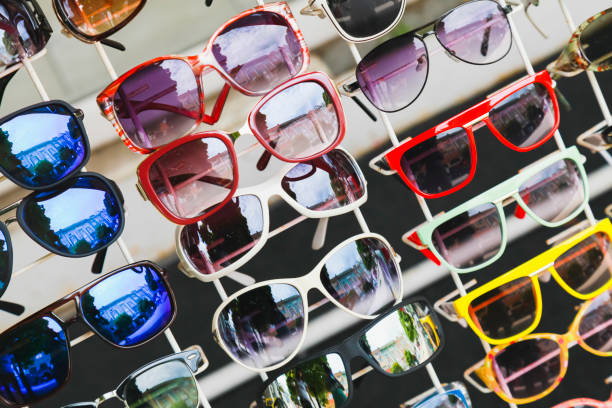 istock Assortment of colorful sunglasses is on a counter 1283809934